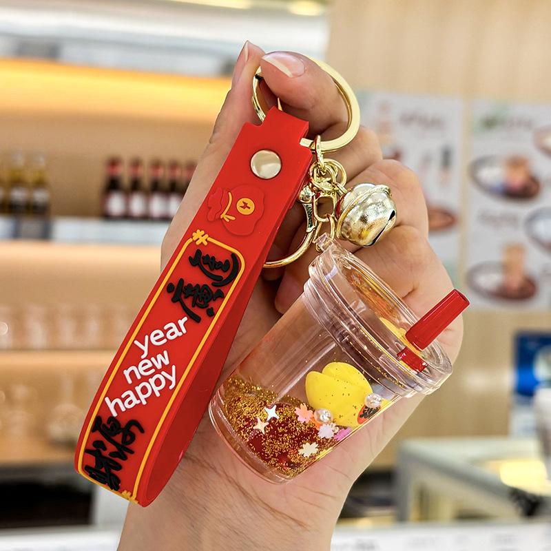 Akrylový přívěsek na klíče s tekutým pískem a obsahem oleje - Perfektní malý dárek na tašku nebo do auta.