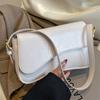 Una borsa da pendolare a mano di nicchia, elegante e semplice, con un alto livello di aspetto e una piccola borsa a tracolla quadrata