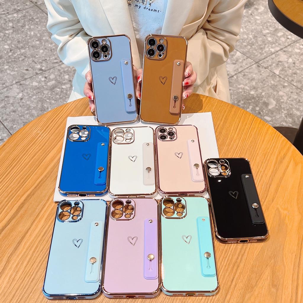 Applicable to iphone17pro mobile phone case Apple hollow love + bracket wristband new 15 Apple 16promax