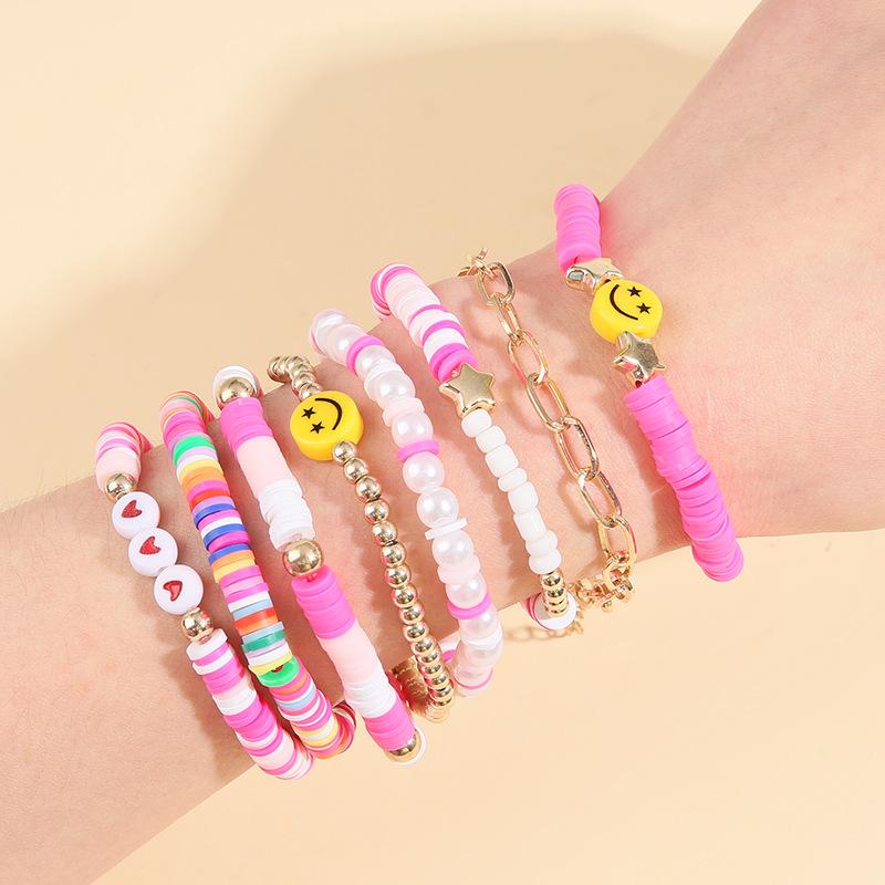 Korean version of fashion new multi-layer elastic thread soft pottery love smiley face bracelet set retro handmade pearl jewelry women