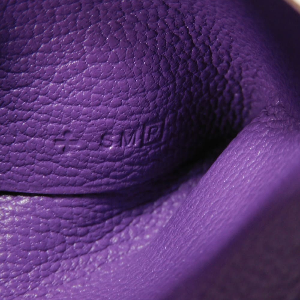 Used 9212 Calvi 7946 Chevre Mysore Goatskin Bag with Gold-stamped Logo and Purple Snap Buttons. Excellent Condition.