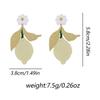 The fruit-themed earrings feature a simple and niche design. The acrylic lemon slice small flower earrings are fresh and versatile for women