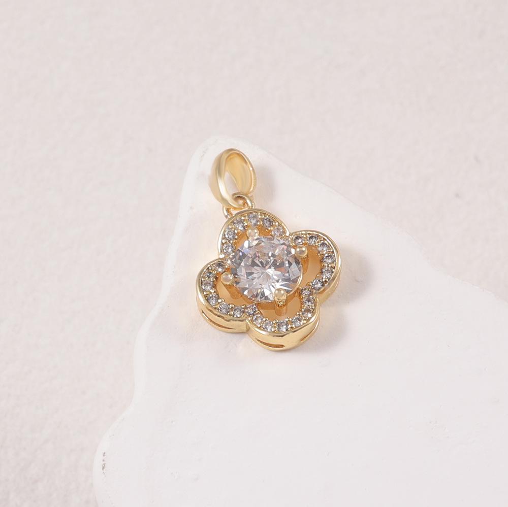 Two-Tone Four-Leaf Clover Diamond Halo Pendant Necklace in Gold and Silver - Women's Fashion Jewelry.
