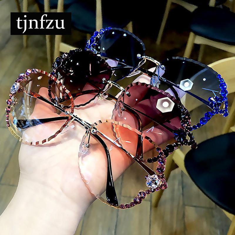 

Модные женщины Rimless Cat Глаз Круглый Солнцезащитные очки Роскошный Rhinestone Металлические очки кадр