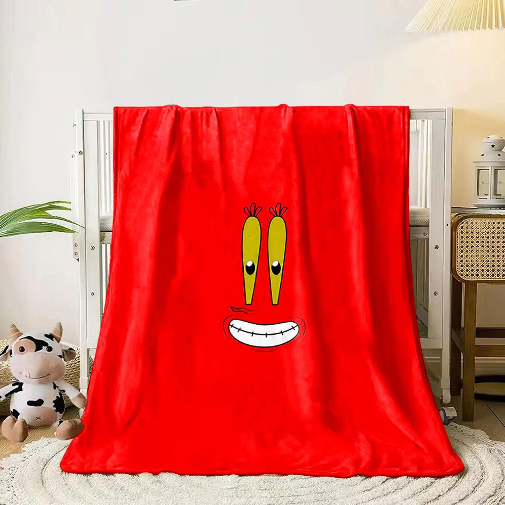 A cartoonish smiling face with big yellow eyes on a red background. for all seasons blanket lunch break throw gift