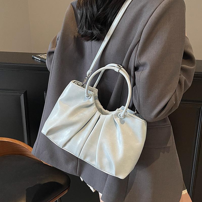 Korean version of foreign style niche design pleated handbag bag women's versatile foreign style advanced sense oil wax leather commuter messenger bag