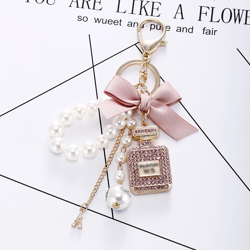 Korean-Style Handmade Rhinestone Perfume Bottle Keychain with Bow and Pearl Charm