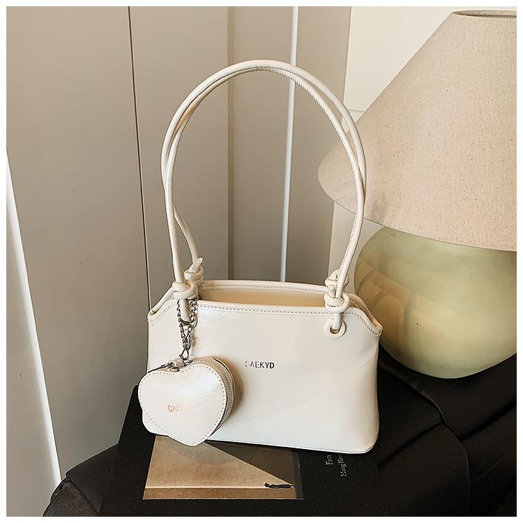 

2025 summer new texture popular portable bucket bag solid color women s simple temperament messenger bag