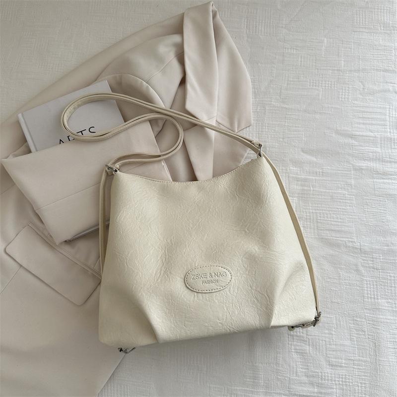 

2025 осень новая корейская версия модная повседневная наплечная сумка-тоут большой вместимости для поездок на работу нишевая простая женская сумка с двойным плечевым ремнем белый