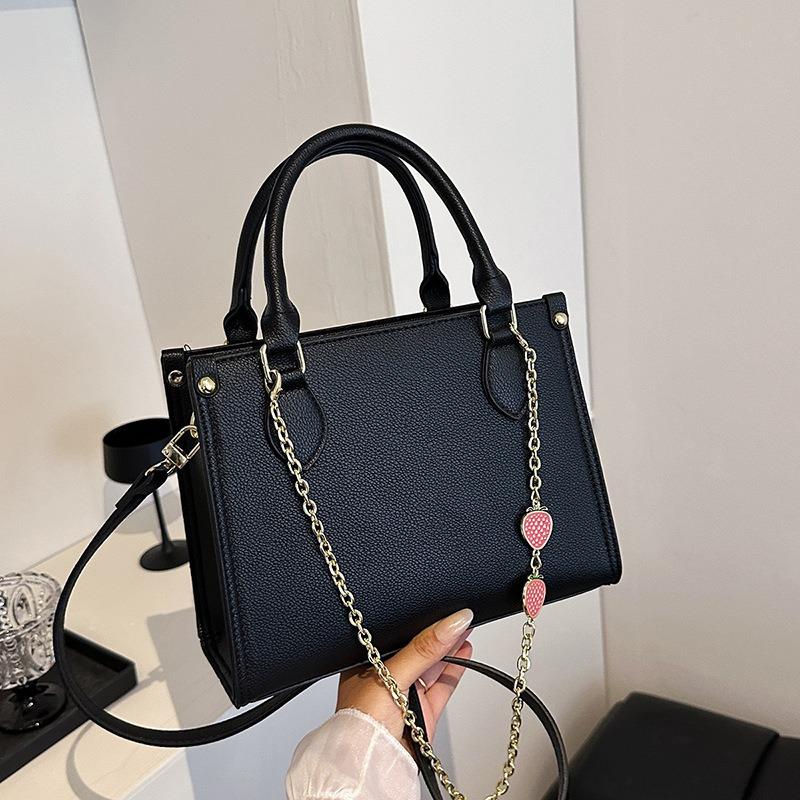 

Fashion classic women s bag, small tote bag, portable shoulder oblique span bag, solid color underarm bag. чорний