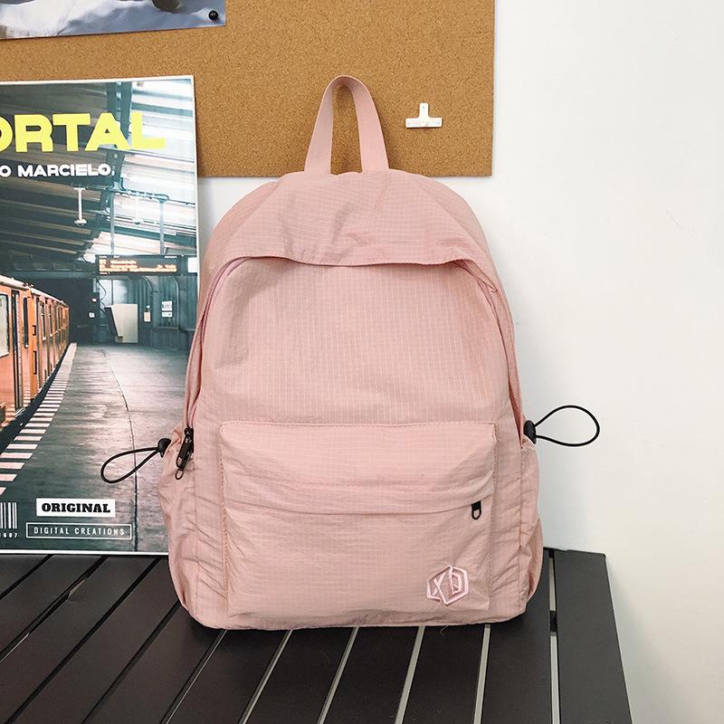 School bag Korean version ins high value backpack early high birth girl casual simple commute versatile large capacity