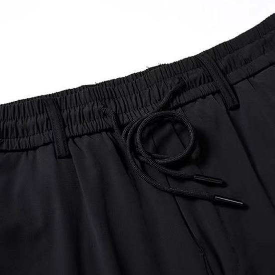 Męskie spodnie Jednolity kolor Elastyczny pas Luźny Elastyczny prosty sznurek Męskie luźne spodnie sznurowane Streetwear