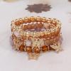 Set di Braccialetti con Ciondolo a Farfalla Perline Bohemien con Design Multistrato di Cristallo