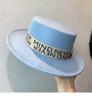New Fedoras Women's Hat Flat Top Cap French Elegant Straw Hat Fedora Pearl Chain Hat Travel Beach Hat Panama Wide Brim Hat