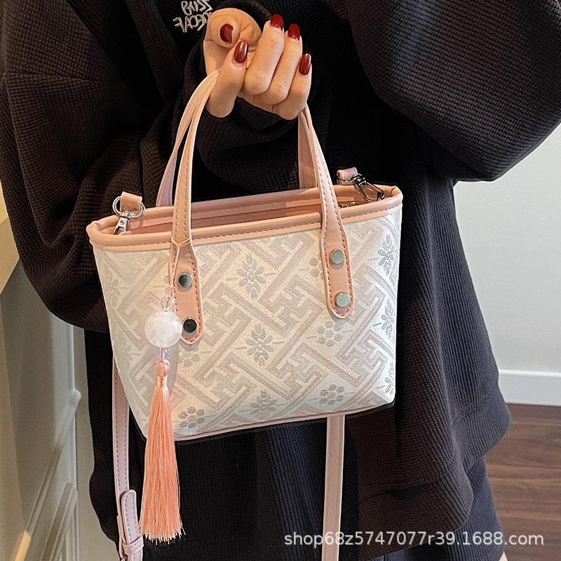 Niche design small bag women's 2025 new foreign style fashion portable bucket cloth bag women's commuter shoulder messenger bag