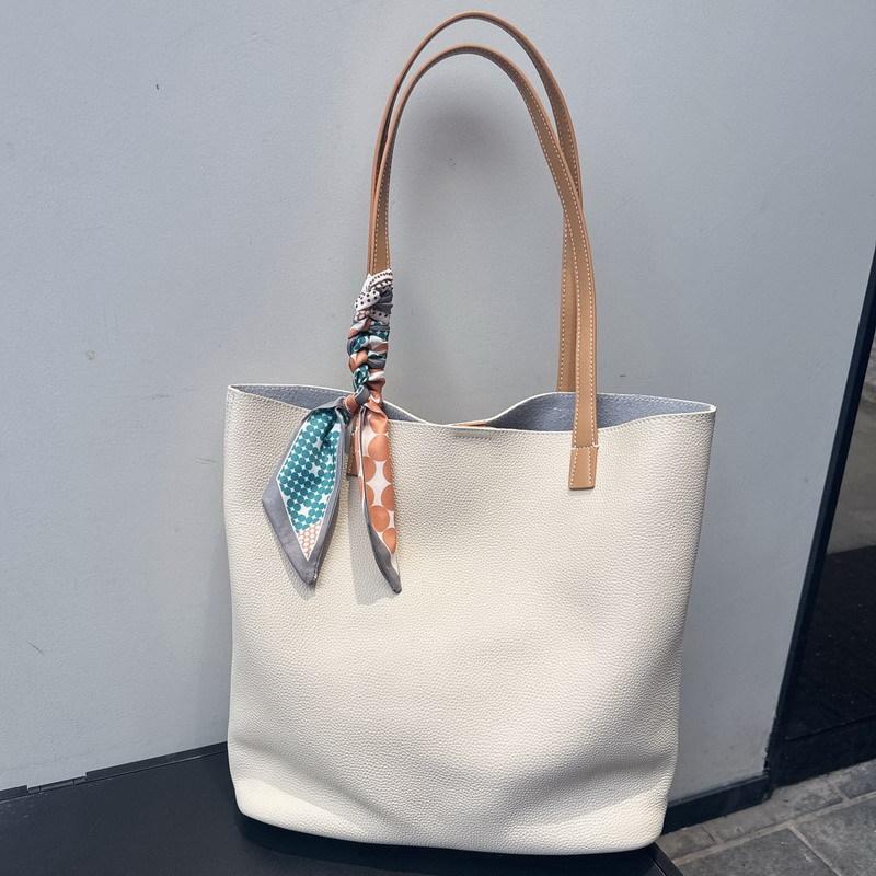 

New leather cowhide women s bag high-end large bucket bag retro commuter bag portable shoulder bag women 31cm*11cm*33cm