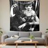 A Woman with a Glamorous Appearance Holds a Black Dog In an Elegant Pose. Patterned Tapestry for Bedroom and Living Room Home Decor