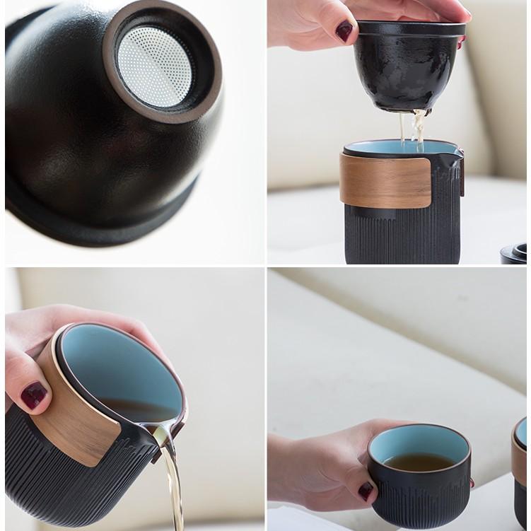 Svart keramiskt snabbte-set med en tekanna och fyra koppar