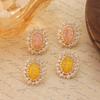 Light Luxury High-End Versatile 10 * 14 Oval Gemstone Inlaid Zircon Silver Needle Stud Earrings.