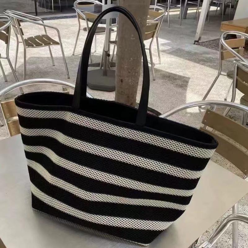 Korean version of large-capacity tote bag cowhide splicing contrasting color bucket bag summer new hollow woven bag lazy wind bag