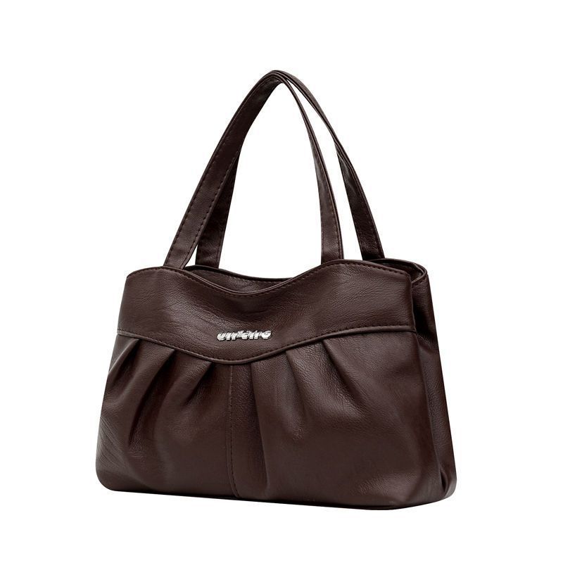 A Lady Commutes To and From Work with Her Mother's Bag In Hand