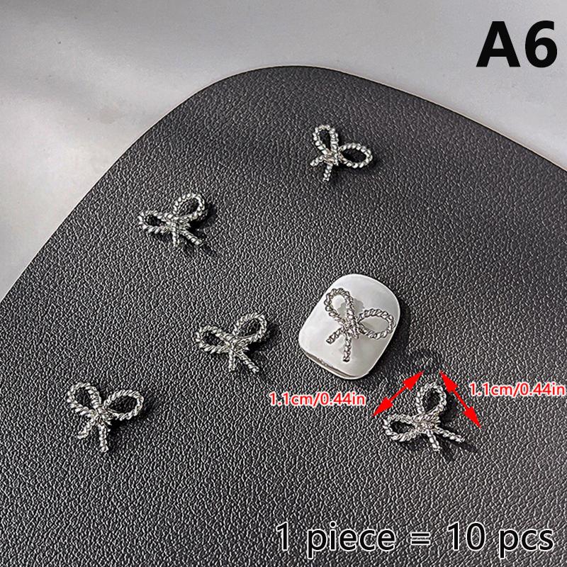 10 ks Jednoduché Tenké Mašličky Stříbrné Kroucené Slitiny Ozdoby na Nehty Manicura Přívěsky