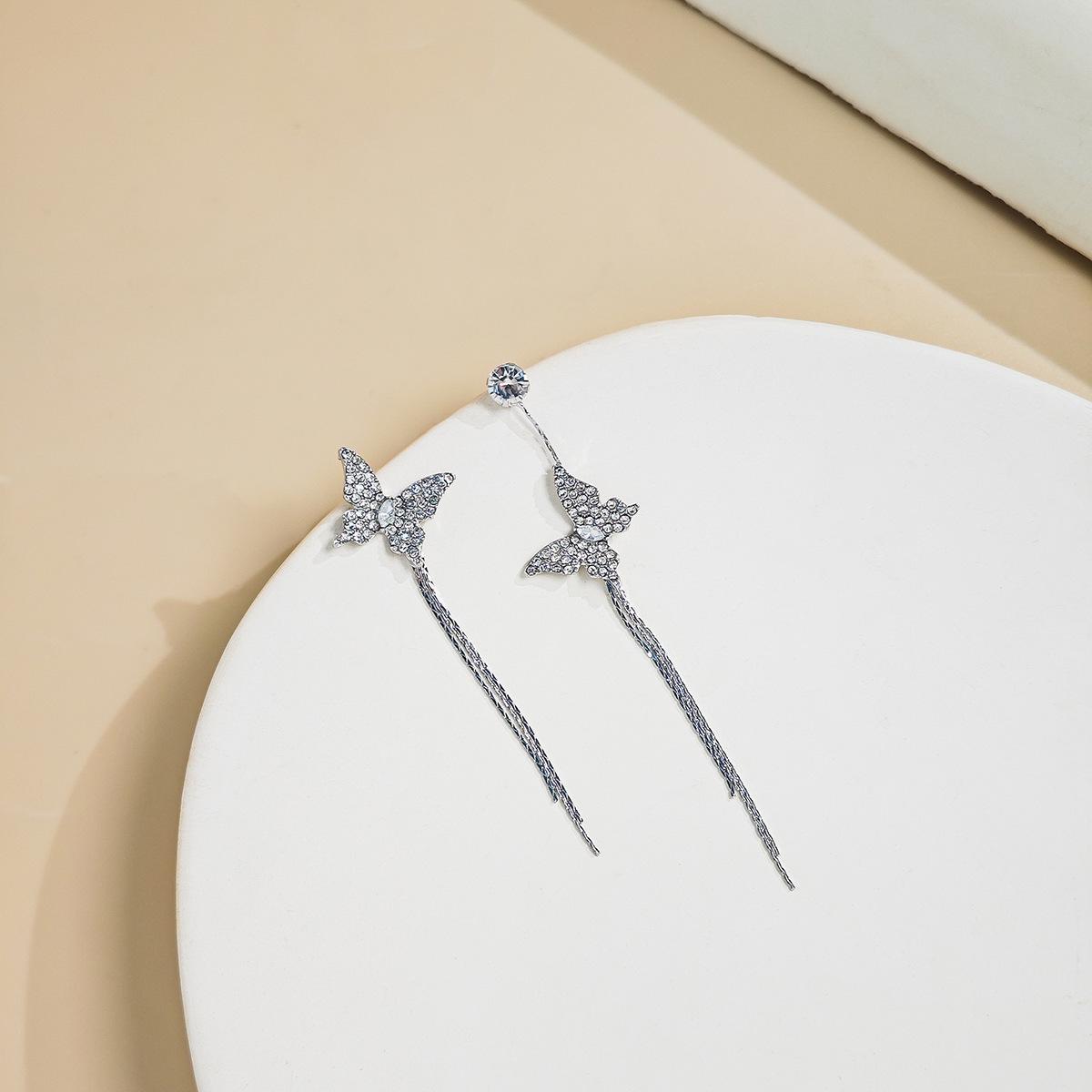 Silver Sparkle Asymmetrical Butterfly Rhinestone Tassel Earrings
