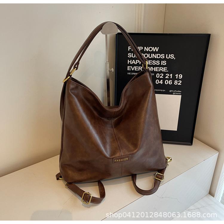 

Korean version of fashionable large-capacity underarm women s bag 2025 autumn new high-end simple tote bag versatile messenger bag коричневий