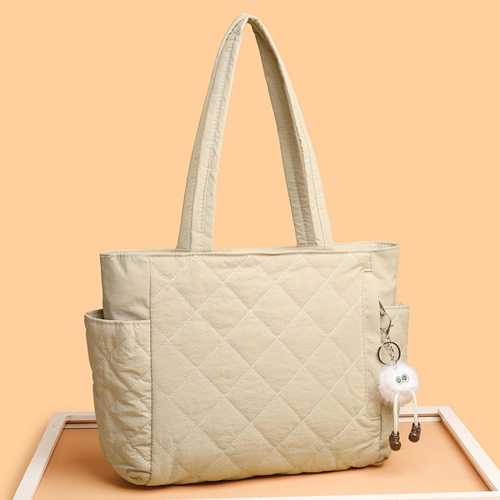 Tragetasche, Eine lässige und leichte Ein-Schulter-Handtasche mit großem Fassungsvermögen in Diamantform