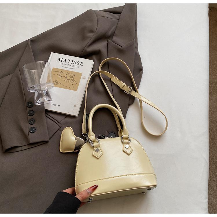 

Классическая популярная сумка-ракушка 2025, универсальная модная новая портативная женская сумка, портативная наплечная сумка-мессенджер