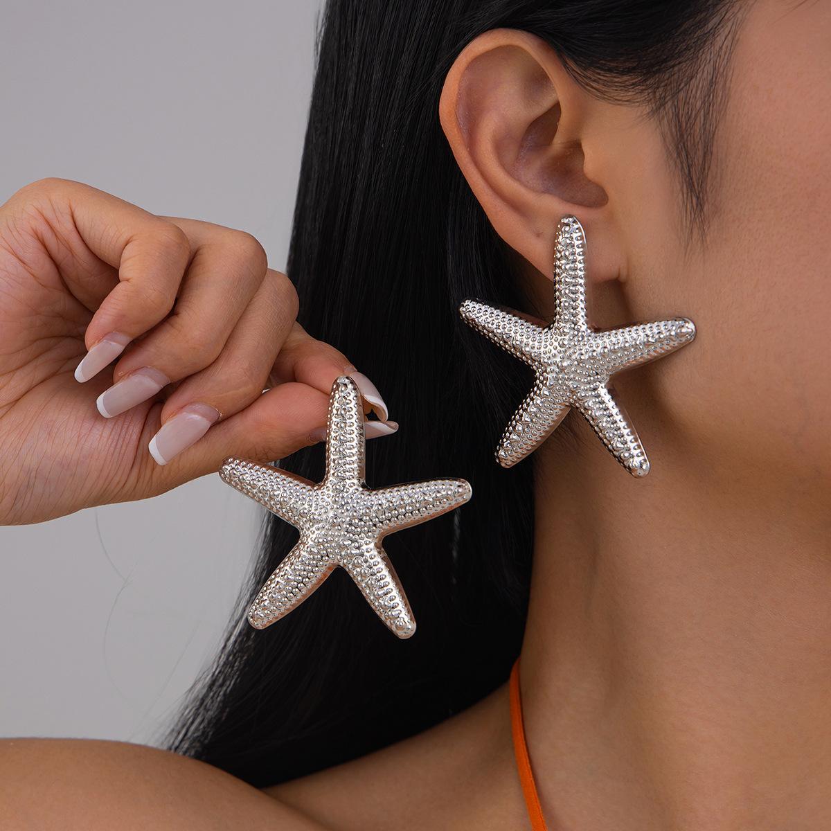 

Літній пляж Ocean Exaggerated Star Stud Earrings Personalized Trendy Vacation Imitation Pearl Morrish Star Metal Earring for Women Girl