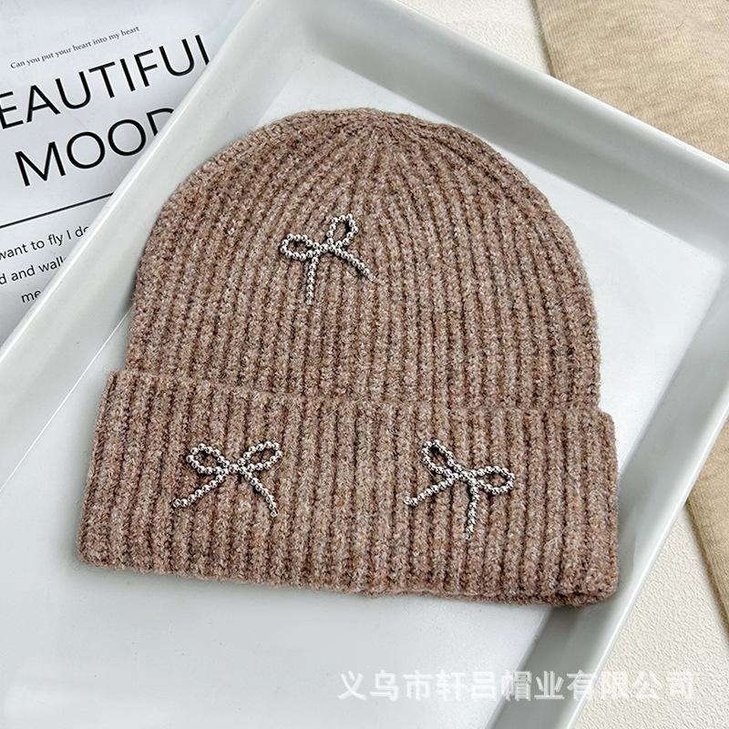 Autumn and winter new Xiaoxiangfeng steel ball bow wool hat versatile women's big head circumference ear protector knitted cold hat