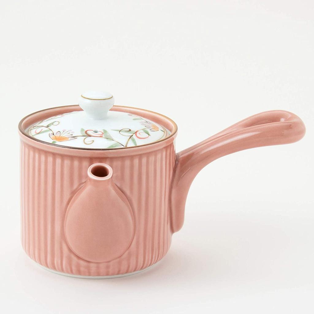 This lightweight teapot features a hand-painted floral lid, a 9cm diameter, and a 350ml capacity. Its delicate pink design features a long,