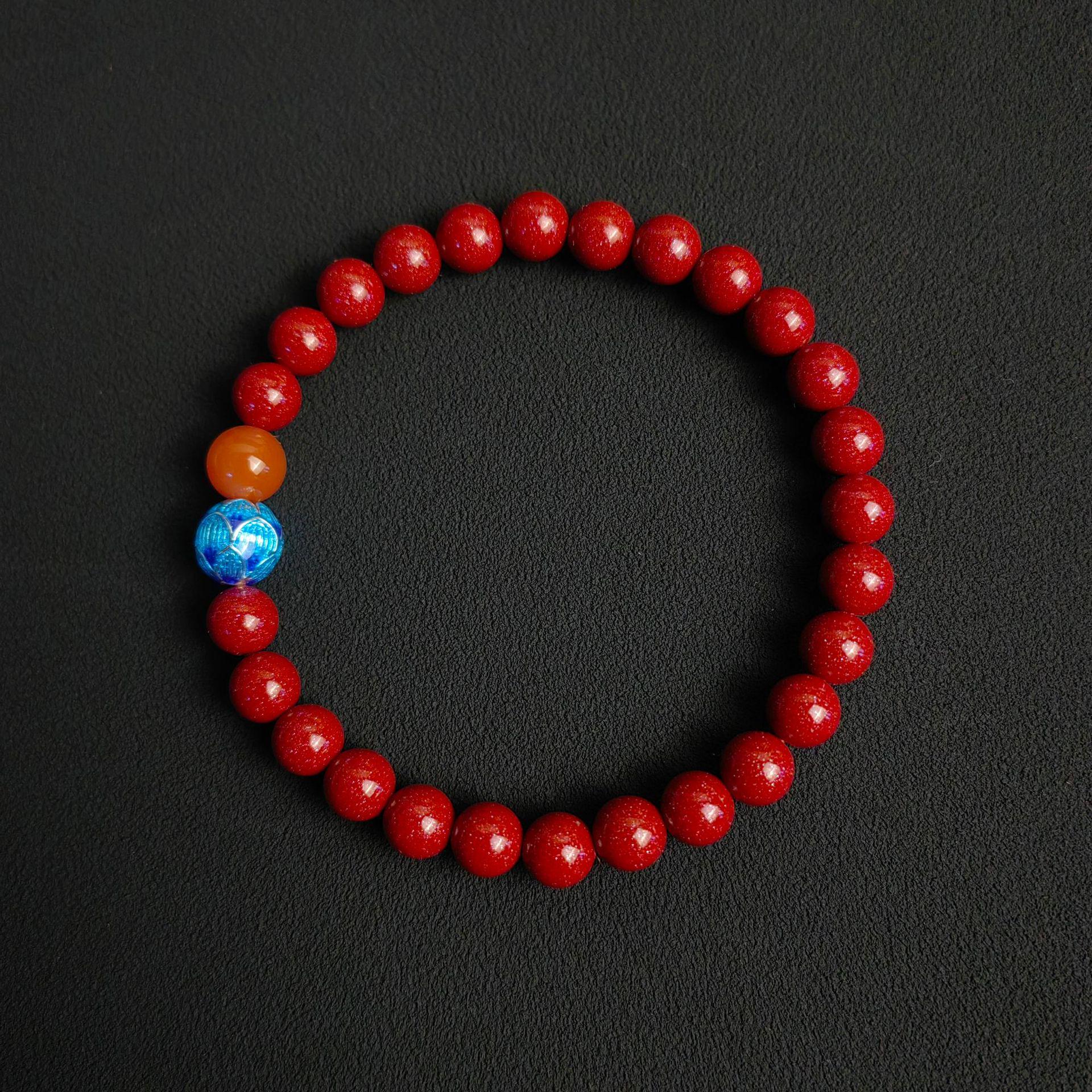 

Tri-Color Lotus Bracelet with Faceted Beads: Purple Gold Sand, Cinnabar, Red, Orange, Blue for Women