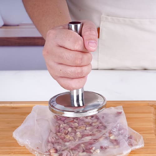 Dishwasher-safe meat tenderizer for tenderizing garlic, walnuts, and other meats. Flat, smooth, and lightweight, with a compact, ergonomic handle.