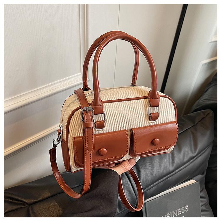 

New spring and summer niche design shoulder bag large capacity oblique span bag retro fashion versatile bag коричневий