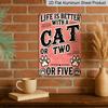 2D Flat, Vintage Metal Wall Art Sign with "Life Is Better with A Cat or Two" Quote - Rustic Distressed Pink & Black Cat Paw Print Decor for Man Cave