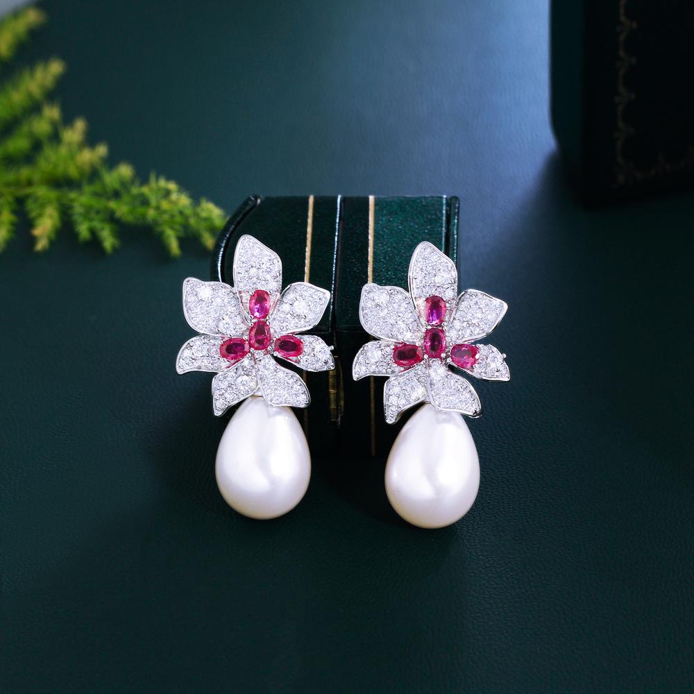 

Женские серьги с элегантным дизайном в стиле легкой роскоши, с искусственным жемчугом в виде цветка, модные и универсальные, нишевого дизайна