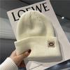 Cute smiley face label wool hat women's autumn and winter warm trend versatile ear protector black knitted hat men