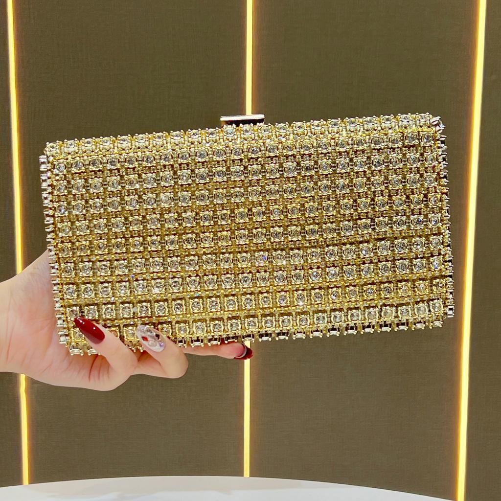 Lady Holding A Fashionable Evening Bag. Designer Water Droplet Chain Handbag for Ladies. Shoulder Bag for Ladies. Casually