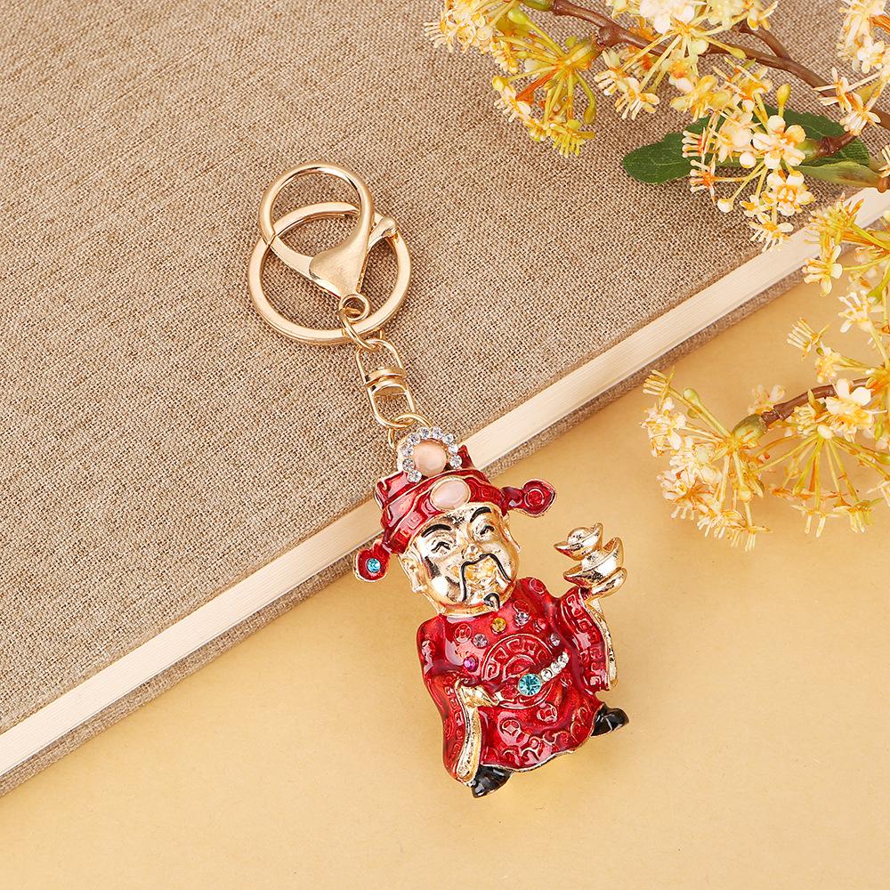 

Chinese God of Wealth Keychain: Rhinestone & Metal Pendant with Handmade Oil Painting