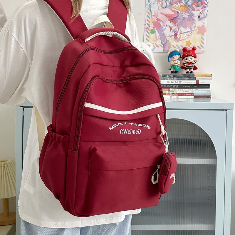 

Large-capacity backpack New junior high school and high school student schoolbag Simple high-value versatile backpack Student schoolbag червоний
