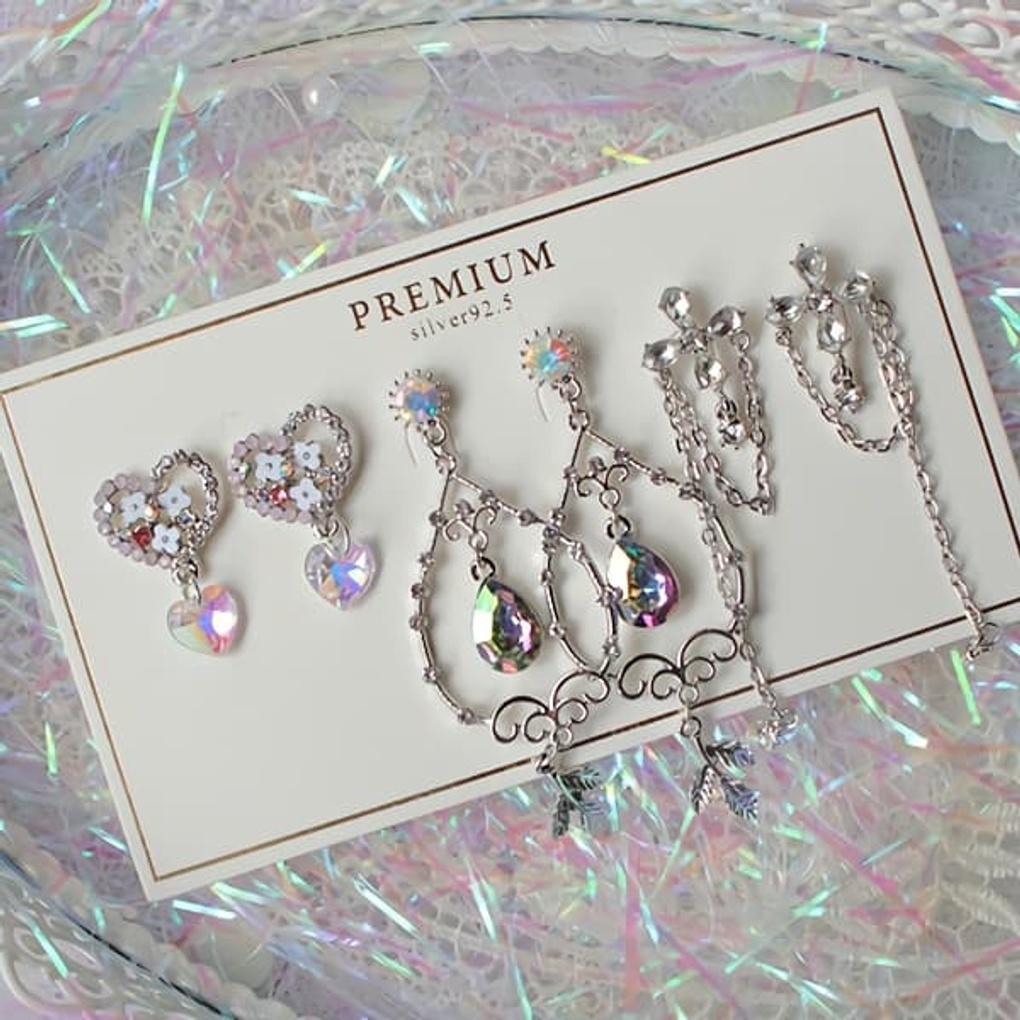 

Жіночий Срібний Набір з 5-ти Фіолетових Сережок та Браслета earring set