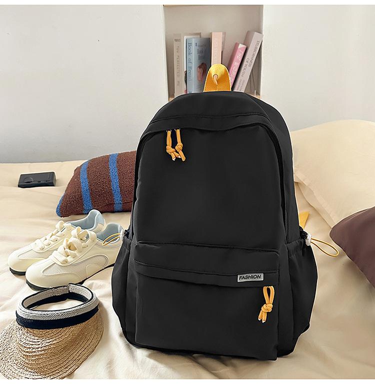 Schoolbag Korean version ins Solid color simple schoolbag Lazy wind backpack Female junior and high school students lightweight large-capacity 