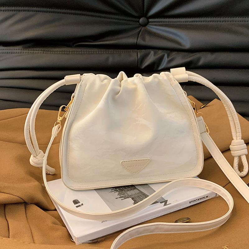 

Bag Korean High Value Bucket Bag Summer New Niche Design One Shoulder Crossbody Bag Women s Pleated Bag with pendant