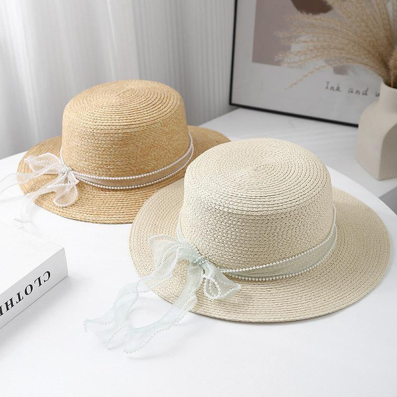 New French Lafite Sweet Bow Straw Hat Women's Spring Summer Simple Sunscreen Breathable Sunshade Elegant Flat Top Hat