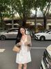 Women's Stylish V-Neck Sleeveless Summer Dress: Loose Fit, Slimming, Solid Color, Short Skirt - New Fashion Collection.