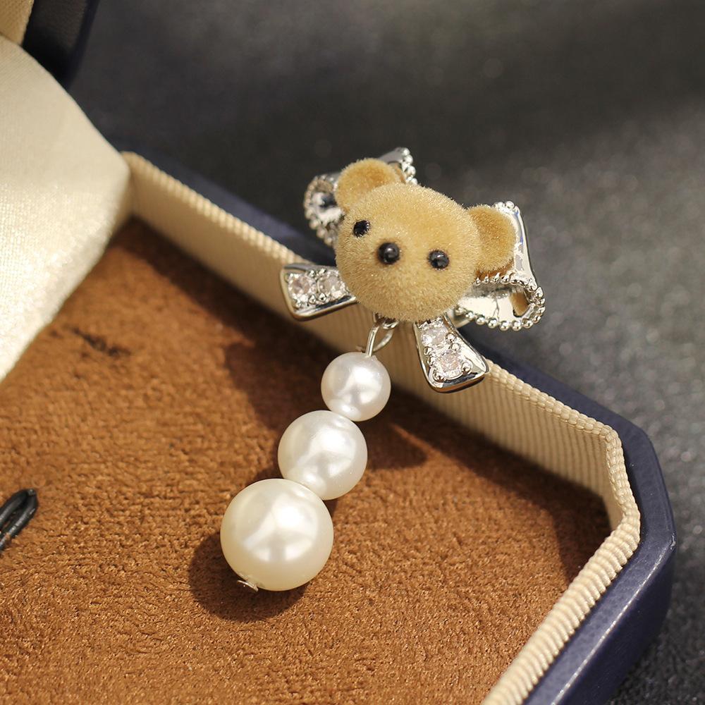 Korean version flocked bear bow brooch simple imitation pearl tassel versatile fixed buckle small collar pin women's accessories