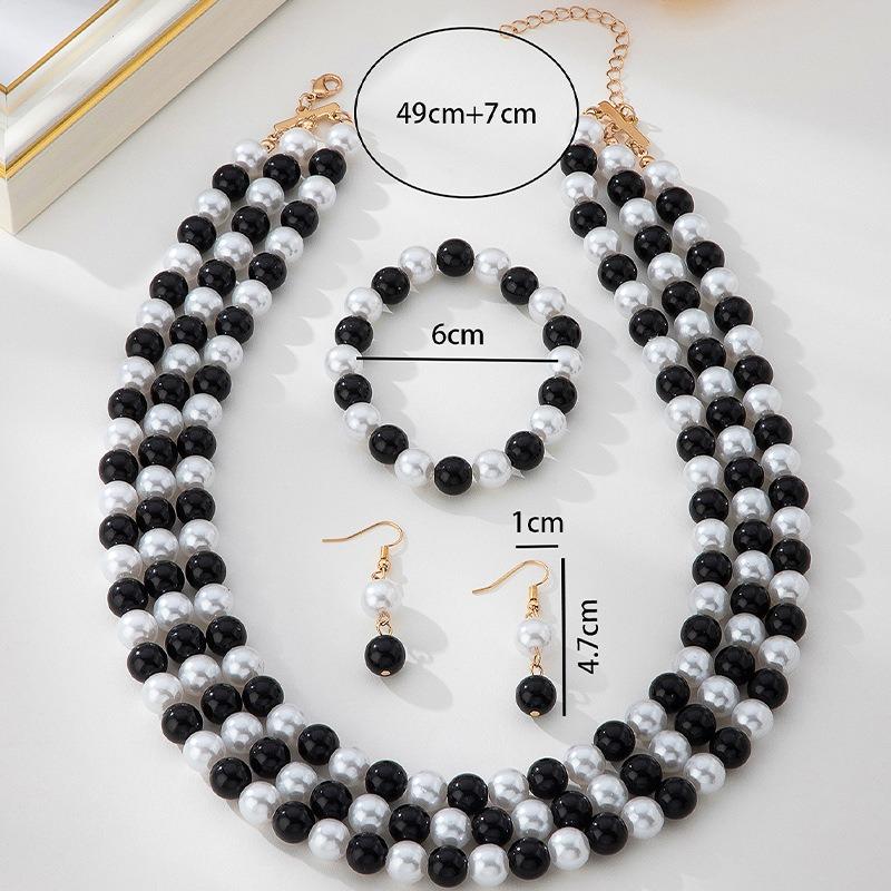 Nuovi Squisiti Design Orecchini, Bracciali, Set Collana con Design Perla Bianca e Nera Lucida