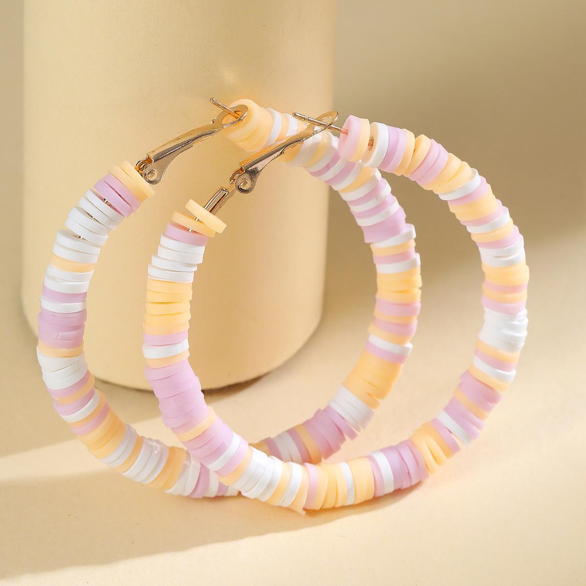 

Bohemian beach earrings C-shaped soft pottery film colored stud earrings female street shot Internet celebrity exaggerated earrings